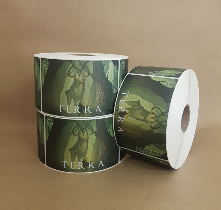 Terra wine label rolls featuring illustrated stag artwork on green background