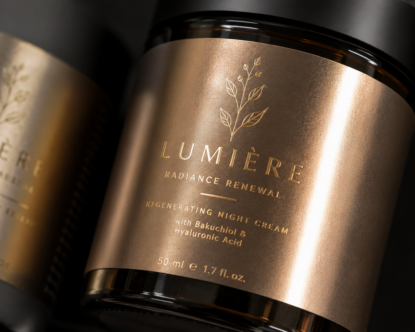 Metallic gold cosmetic label on a dark glass jar with foil-stamped botanical detail
