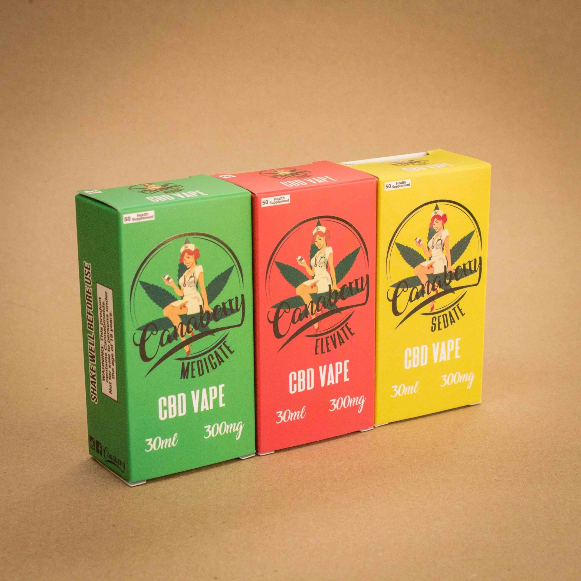 Canaberry CBD Vape folding cartons in green Medicate, red Elevate and yellow Sedate with pin-up nurse logo